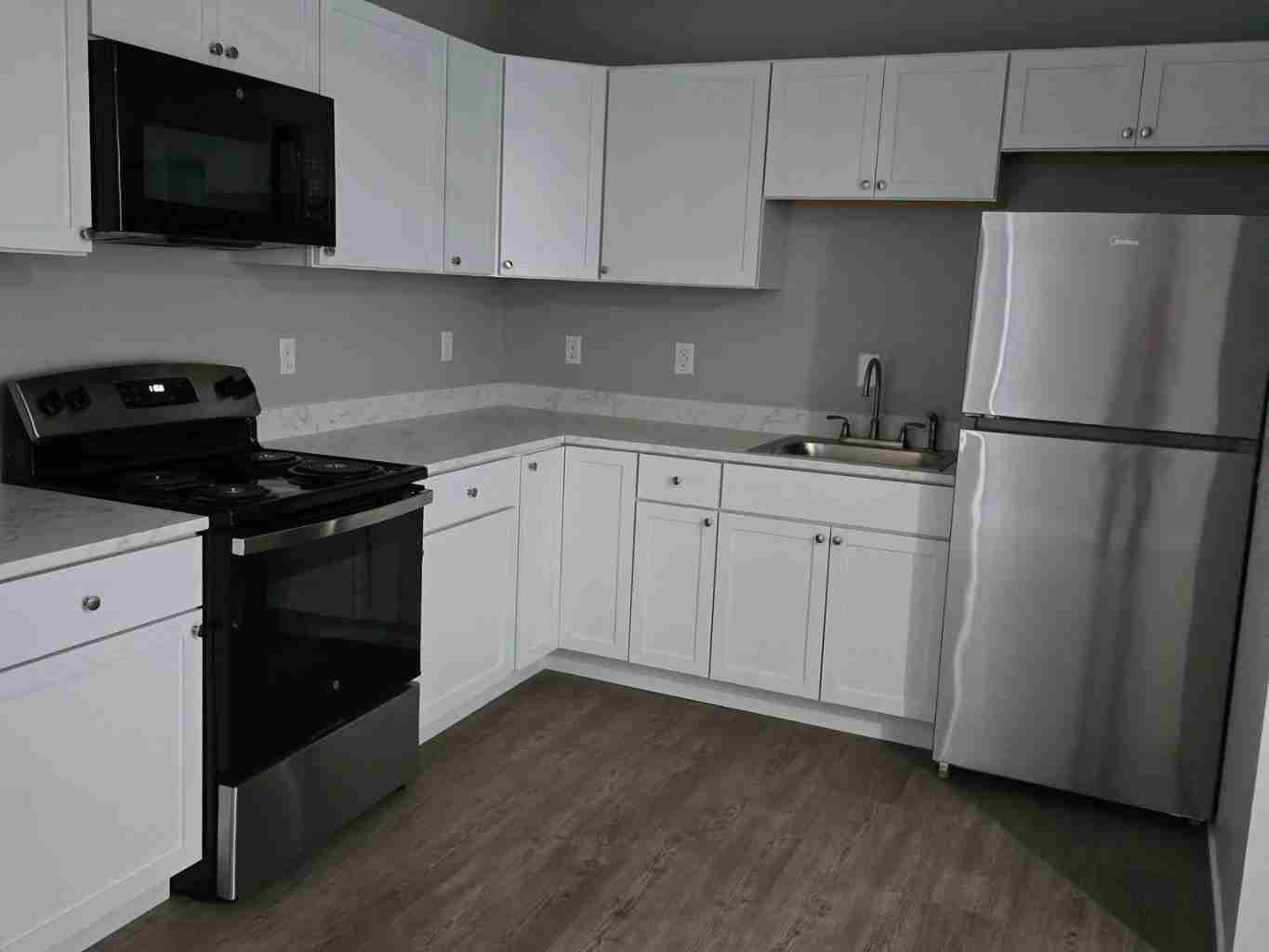 Finished home interior remodel by E & A Construction LLC featuring updated flooring, lighting, and modern design in Indiana