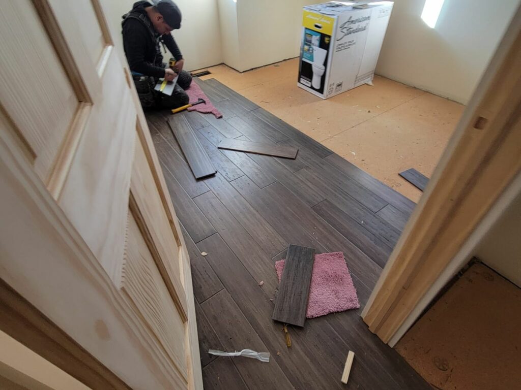 New hardwood floor installation completed by E & A Construction LLC in a remodeled Indiana home