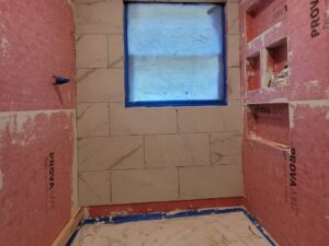 Modern bath remodel in Indiana by E & A Construction LLC featuring new flooring and updated interior design